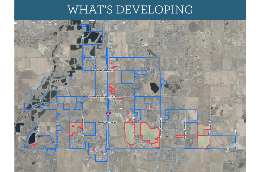 Map titled "What's Developing" showing areas outlined in blue and red in a town development