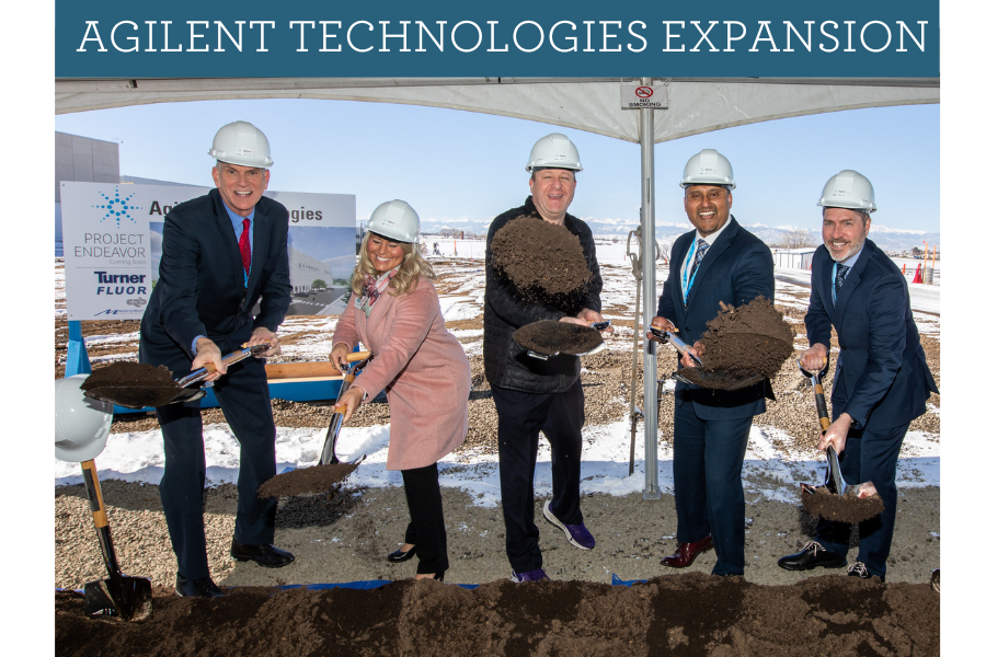 Group of five individuals in hard hats participating in a groundbreaking ceremony for the Agilent Te