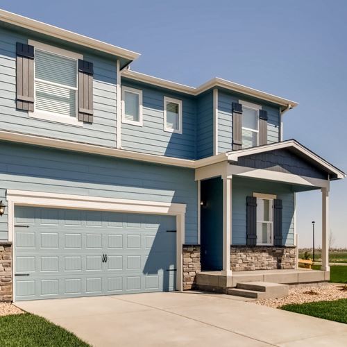 [Image Description: An image of the front of a two-story light blue house]