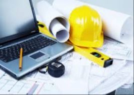 A laptop, yellow hard hat, blueprints, level, and measuring tape are placed on a desk.